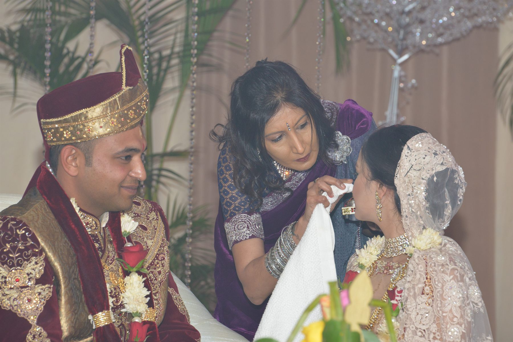 A bride’s veil being adjusted before the ceremony